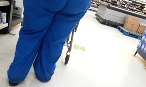 Big wide booty in scrubs bending over and showing off.