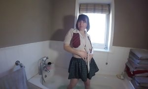 Mischievous college girl in the bathtub getting sloppy