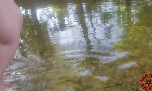 Pissing and cum on her face at the creek