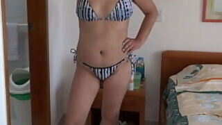 On the beach&comma; my stepmom in a bikini shows me her hairy pussy&comma; ass&comma; and tits&period;