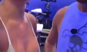 Nicole Scherzinger in gym displaying hefty bosom in milky top