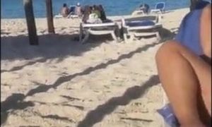 Beach cougar plays with herself