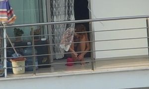 Mature Woman Nail Polishing with bra at Balcony 1