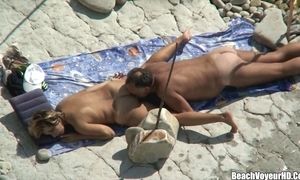 Hubby munching his wifey backside & twat at naturist beach voyeur